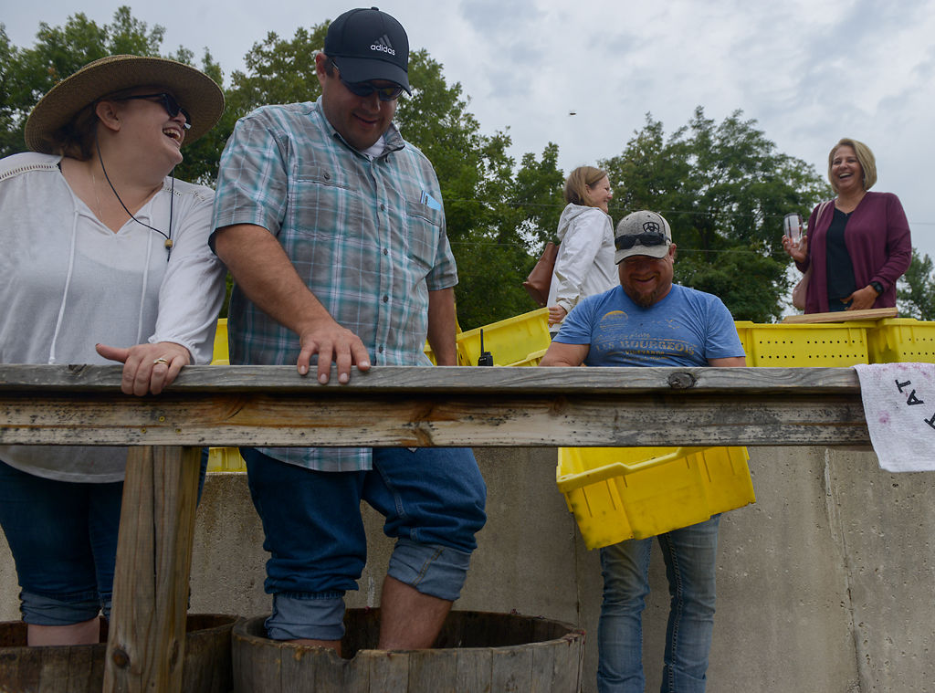 Amy Carey, Jason Carey and Larry Lopez laugh on Saturday